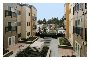 Photo of a courtyard at Savoy Lake City apartments.